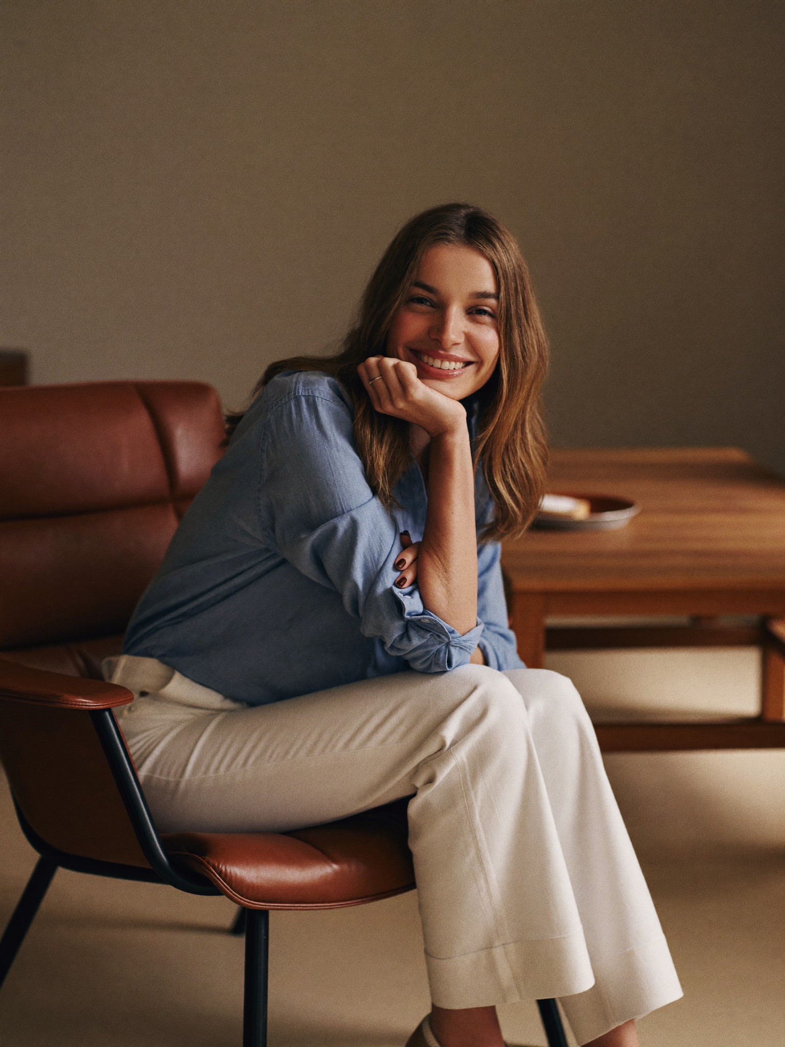 A mother at ease, some time after traveling for her mommy makeover