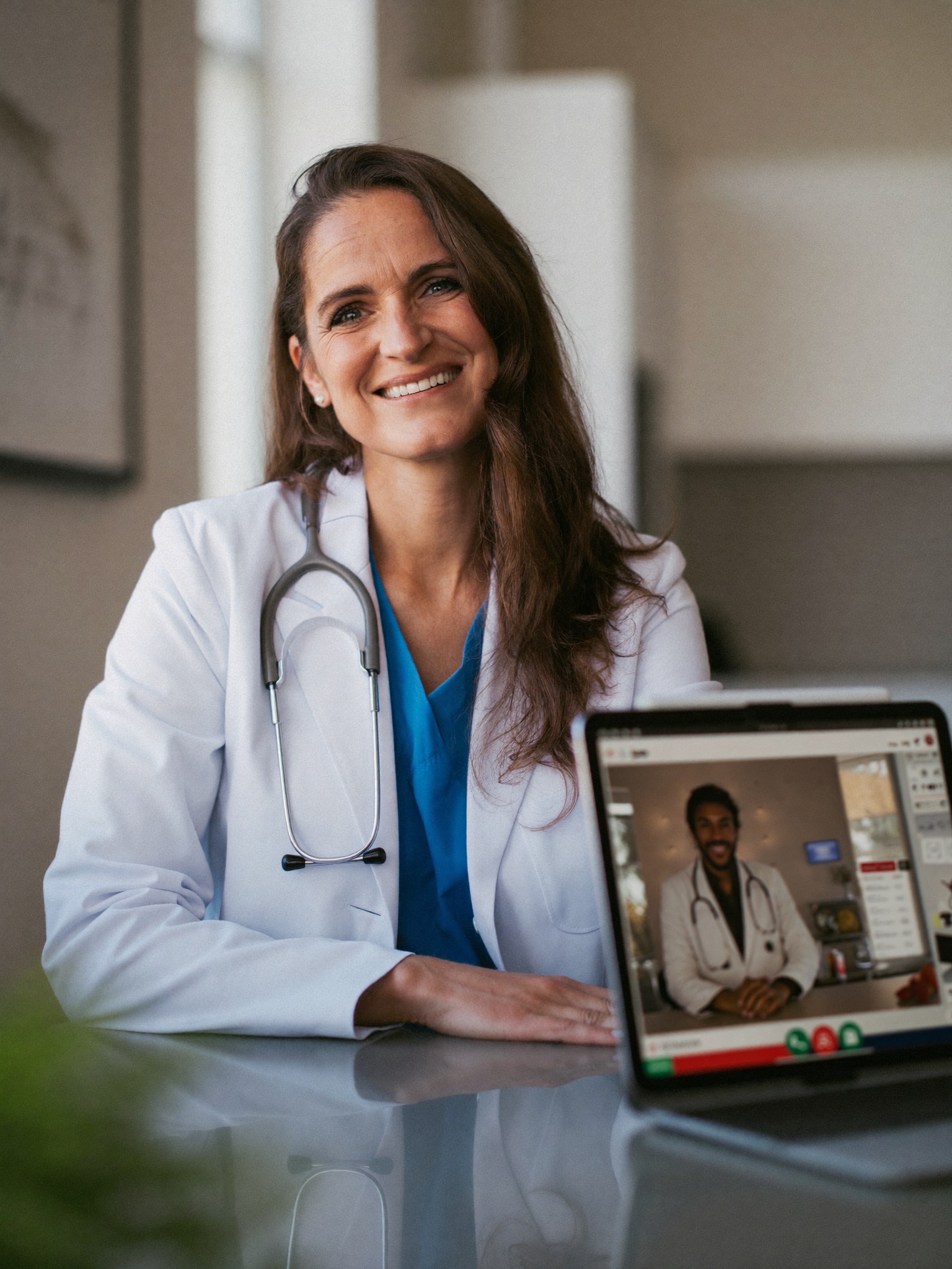 Dr. Elena Reyes, warm and reassuring, on a virtual consult call from her Miami practice