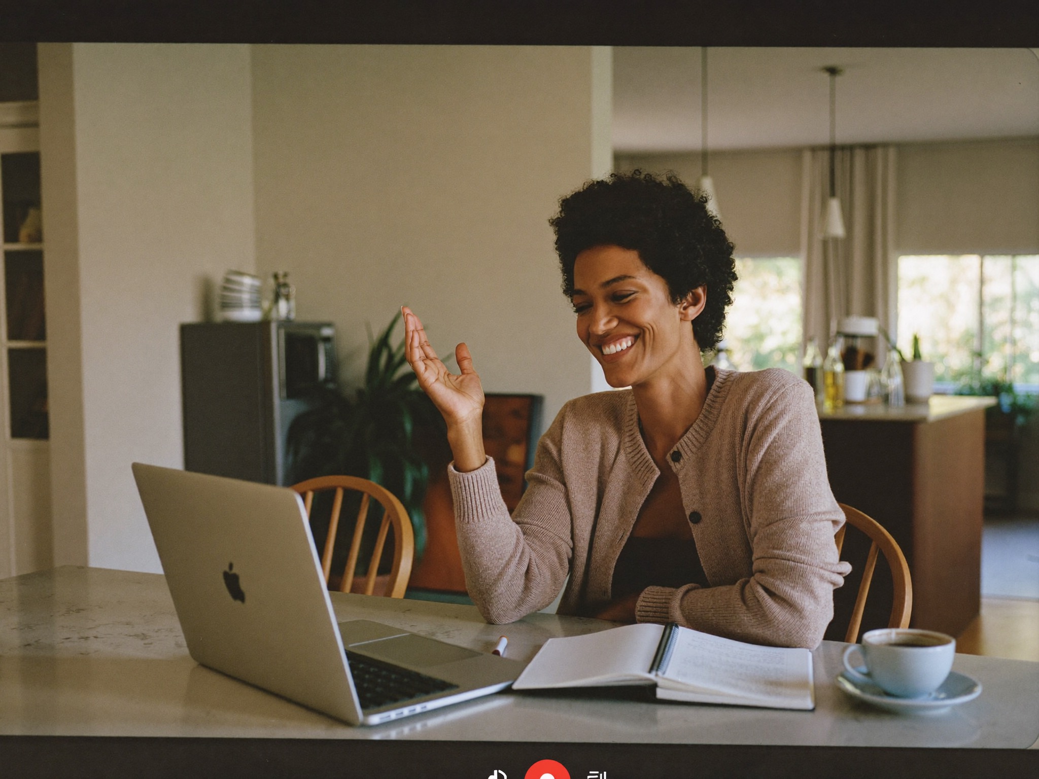 A mother having her free virtual consultation from her kitchen table at home