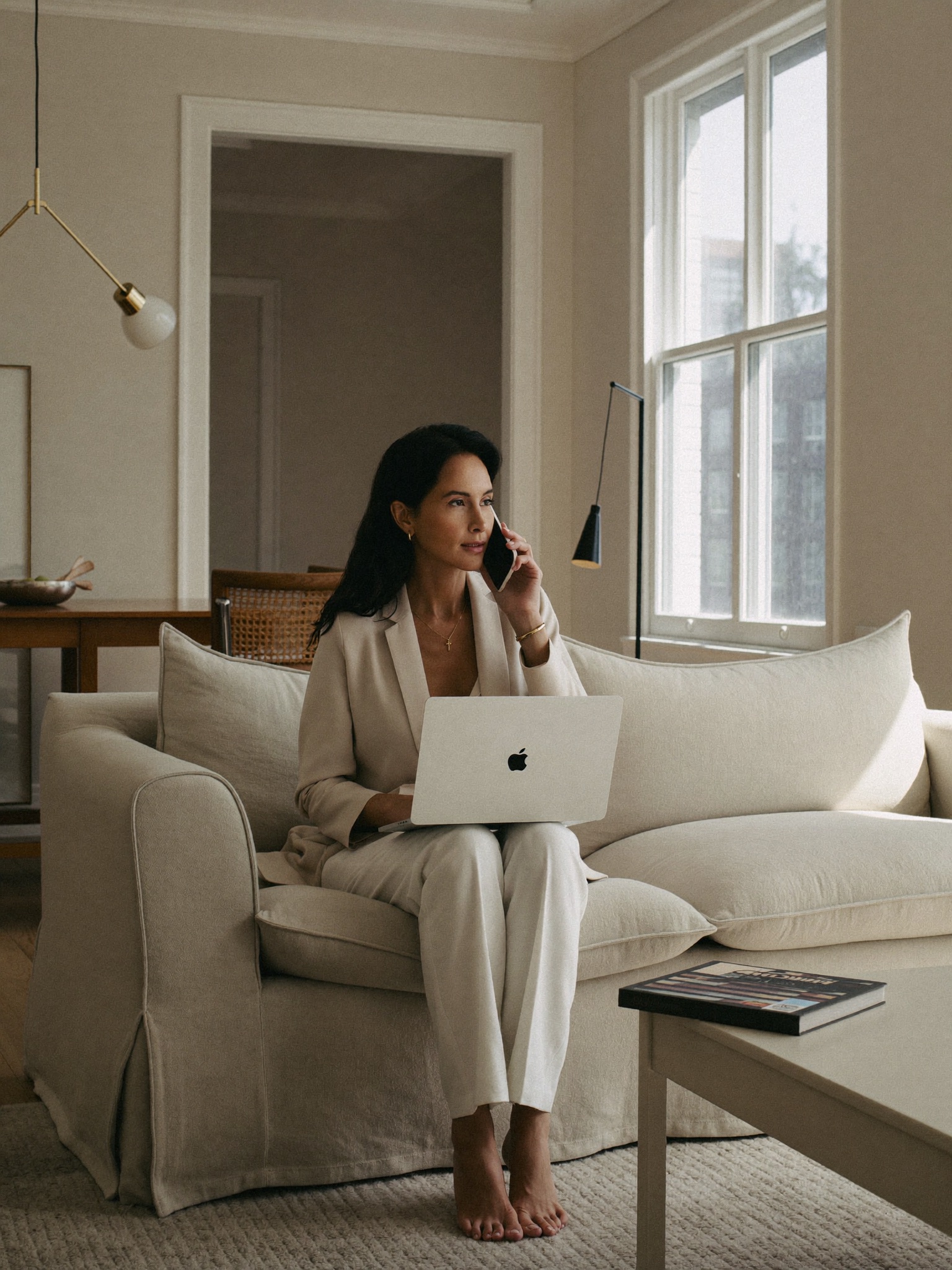 A composed woman having a private virtual consultation from her own living room